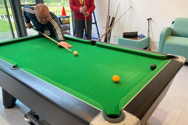 Peter Ramsay plays pool at the Hawkhead Centre