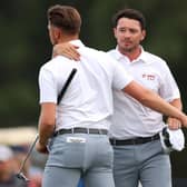 Ewen Ferguson and Richard Mansell celebrate halving their fourball match on the opening day of the Hero Cup. Picture: Andrew Redington/Getty Images.