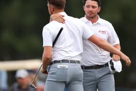 Ewen Ferguson and Richard Mansell celebrate halving their fourball match on the opening day of the Hero Cup. Picture: Andrew Redington/Getty Images.