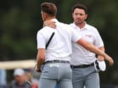 Ewen Ferguson and Richard Mansell celebrate halving their fourball match on the opening day of the Hero Cup. Picture: Andrew Redington/Getty Images.