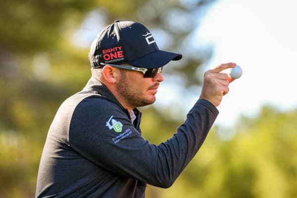 Ewen Ferguson shows his ball to a playing partner during the Rolex Challenge Tour Grand Final supported by the R&A at T-Golf & Country Club in Mallorca. Picture: Octavio Passos/Getty Images.