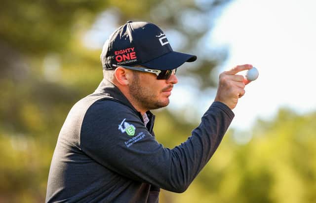 Ewen Ferguson shows his ball to a playing partner during the Rolex Challenge Tour Grand Final supported by the R&A at T-Golf & Country Club in Mallorca. Picture: Octavio Passos/Getty Images.