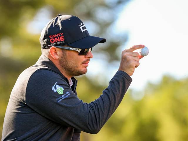 Ewen Ferguson shows his ball to a playing partner during the Rolex Challenge Tour Grand Final supported by the R&A at T-Golf & Country Club in Mallorca. Picture: Octavio Passos/Getty Images.