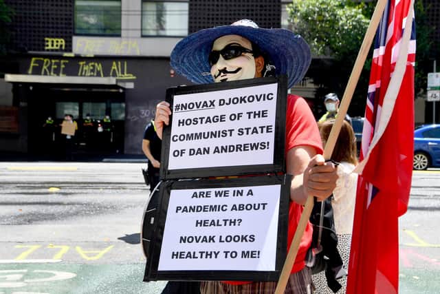 Novak Djokovic's supporters have falsely claimed the tennis star is being held prisoner despite the fact he is free to leave Australia (Picture: William West/AFP via Getty Images)