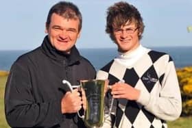 Paul Lawrie presented David Law with the trophy after his win in the 2009 Scottish Boys' Championship at Royal Aberdeen. Picture: Scottish Golf