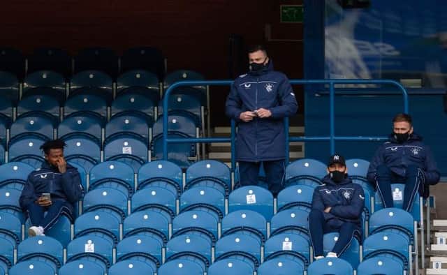 Bongani Zungu, left, looks on with fellow sidelined team-mates George Edmundson, Nikola Katic and Greg Stewart during Rangers' 4-0 win over Aberdeen at Ibrox on Sunday. (Photo by Craig Foy / SNS Group)