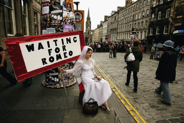 Street entertainers perform on the Royal Mile as part of the Edinburgh Festival Fringe  (Picture: Jeff J Mitchell/Getty Images)