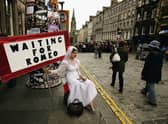 Street entertainers perform on the Royal Mile as part of the Edinburgh Festival Fringe  (Picture: Jeff J Mitchell/Getty Images)