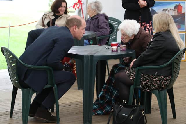 The Duke of Cambridge chats to Betty Magee, a resident of Queen's Bay Lodge Care Home in Edinburgh, and her granddaughter Kimberley Anderson during his visit. Picture: Andrew Milligan/PA Wire.