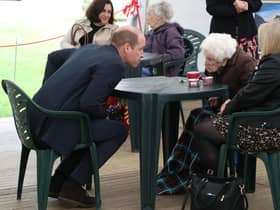 The Duke of Cambridge chats to Betty Magee, a resident of Queen's Bay Lodge Care Home in Edinburgh, and her granddaughter Kimberley Anderson during his visit. Picture: Andrew Milligan/PA Wire.