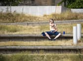 A man enjoys the sun in Holyrood Park in Edinburgh as the UK is hit by a heatwave. Picture: SWNS
