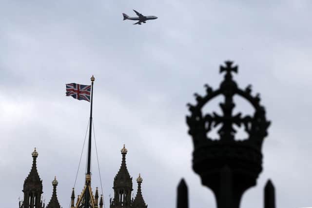 A British flag waves atop of Houses of Parliament. Picture: AP Photo/Thanassis Stavrakis