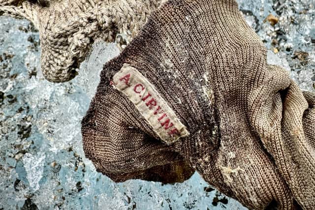 A sock embroidered with "A.C. Irvine" which has been discovered on the Central Rongbuk Glacier below the North Face of Mount Everest. Picture: Jimmy Chin/National Geographic/PA Wire