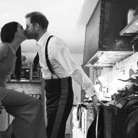 An image issued by Netflix of the Duke and Duchess of Sussex kissing in a kitchen. The picture is part of a trailer for a new documentary called "Harry and Meghan" - the Sussexes' behind the scenes. Picture: Duke and Duchess of Sussex/Netflix/PA Wire