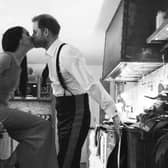 An image issued by Netflix of the Duke and Duchess of Sussex kissing in a kitchen. The picture is part of a trailer for a new documentary called "Harry and Meghan" - the Sussexes' behind the scenes. Picture: Duke and Duchess of Sussex/Netflix/PA Wire