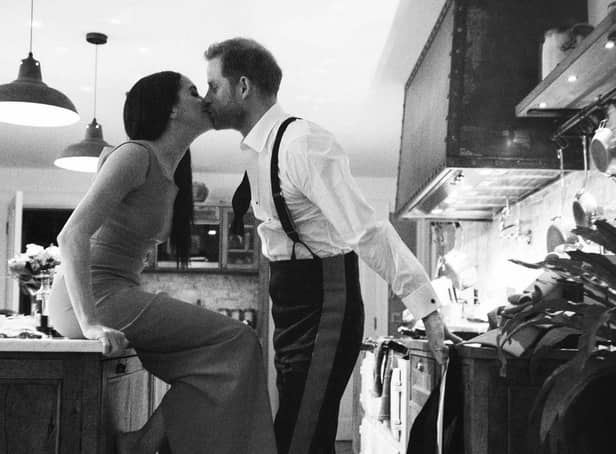 An image issued by Netflix of the Duke and Duchess of Sussex kissing in a kitchen. The picture is part of a trailer for a new documentary called "Harry and Meghan" - the Sussexes' behind the scenes. Picture: Duke and Duchess of Sussex/Netflix/PA Wire
