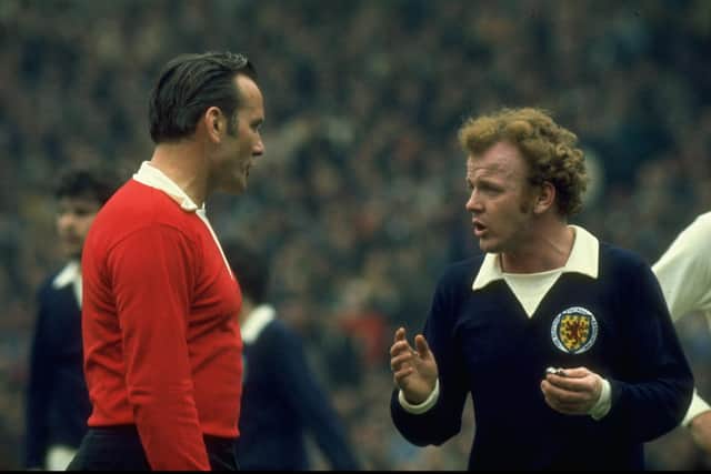 Billy Bremner of Scotland has words with referee Herr Tchencher of Germany in 1973.