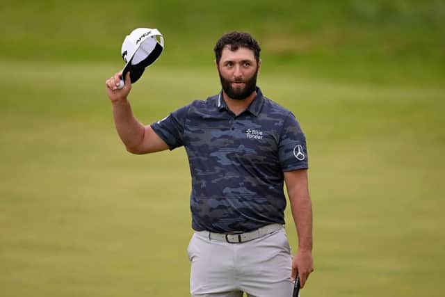Jon Rahm acknowledges the crowd after putting out on the 18th green on day three of the 151st Open at Royal Liverpool. Picture: Ross Kinnaird/Getty Images.