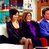 Courteney Cox, Jennifer Aniston and Matthew Perry on the set of Friends. Picture: Getty Images