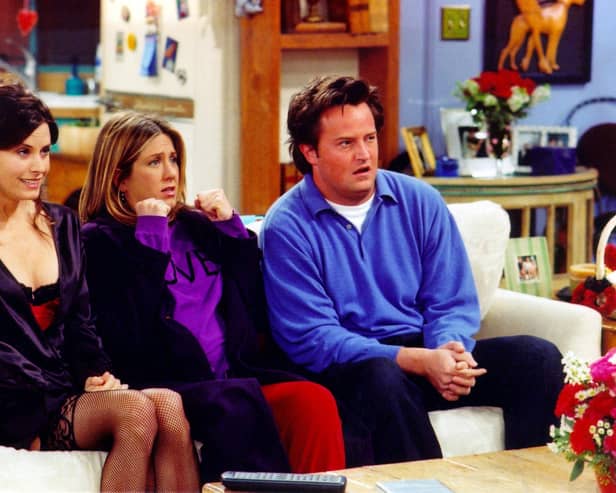 Courteney Cox, Jennifer Aniston and Matthew Perry on the set of Friends. Picture: Getty Images