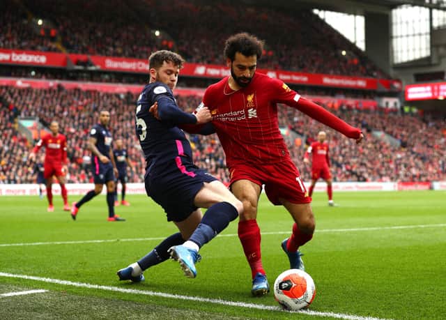 Jack Simpson of AFC Bournemouth battles for possession with Mohamed Salah of Liverpool during the Premier League match  on March 07, 2020. (Photo by Jan Kruger/Getty Images)