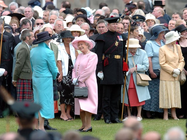 The Queen at one of the regular garden parties held at the Palace of Holyrood in 2004.