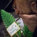 Cannabis enthusiasts smoke joints legally at the Brandenburg Gate shortly after midnight today in Berlin, Germany. Germany's new cannabis law goes into effect today, bringing in a new era of legal cannabis consumption.