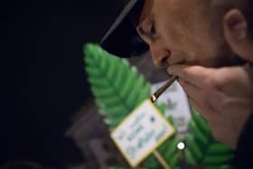 Cannabis enthusiasts smoke joints legally at the Brandenburg Gate shortly after midnight today in Berlin, Germany. Germany's new cannabis law goes into effect today, bringing in a new era of legal cannabis consumption.