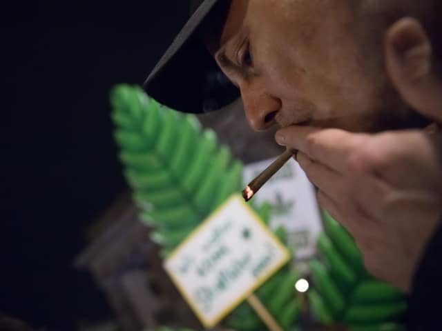 Cannabis enthusiasts smoke joints legally at the Brandenburg Gate shortly after midnight today in Berlin, Germany. Germany's new cannabis law goes into effect today, bringing in a new era of legal cannabis consumption.