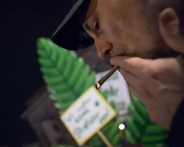 Cannabis enthusiasts smoke joints legally at the Brandenburg Gate shortly after midnight today in Berlin, Germany. Germany's new cannabis law goes into effect today, bringing in a new era of legal cannabis consumption.