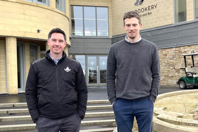 Michael Wells, Chief Executive of Carnoustie Golf Links and Dr Graeme Sorbie of Abertay University outside Links House at Carnoustie Golf Links.