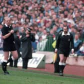 Rangers striker Mark Hateley leaves the field having been shown the red card by referee Andrew Waddell.