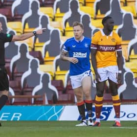 Referee Bobby Madden awards a penalty for a handball against Bevis Mugabi during a Scottish Premiership match between Motherwell and Rangers at Fir Park on 27 September(Photo by Craig Williamson / SNS Group)
