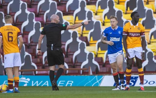 Referee Bobby Madden awards a penalty for a handball against Bevis Mugabi during a Scottish Premiership match between Motherwell and Rangers at Fir Park on 27 September(Photo by Craig Williamson / SNS Group)