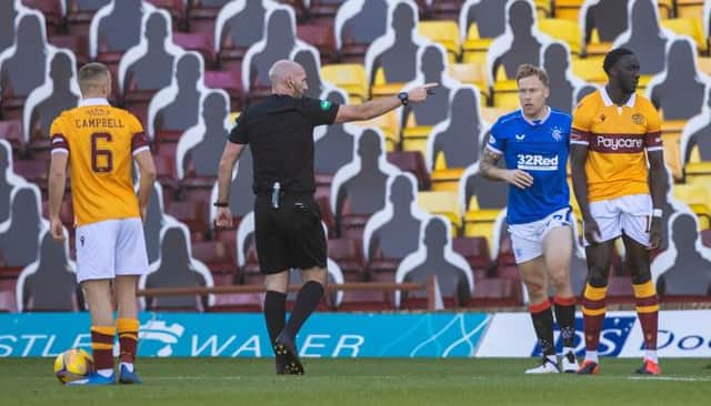Referee Bobby Madden awards a penalty for a handball against Bevis Mugabi during a Scottish Premiership match between Motherwell and Rangers at Fir Park on 27 September(Photo by Craig Williamson / SNS Group)