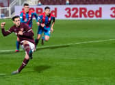 Jamie Walker slots home the only goal of the game from the penalty spot as Hearts defeat Inverness CT at Tynecastle on Tuesday evening. Picture: SNS