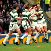 Celtic's John Collins (second right) celebrates his April 1994 derby goal in front of the Rangers fans with Simon Donnelly (right). The celebrations were accompanied by complete silence from the Rangers-only crowd after David Murray banned Celtic fans from the ground