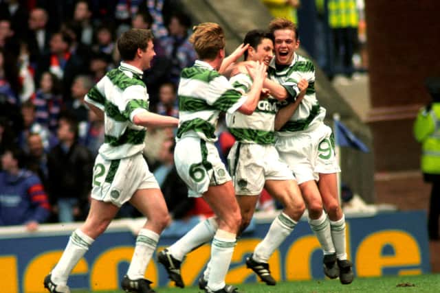 Celtic's John Collins (second right) celebrates his April 1994 derby goal in front of the Rangers fans with Simon Donnelly (right). The celebrations were accompanied by complete silence from the Rangers-only crowd after David Murray banned Celtic fans from the ground