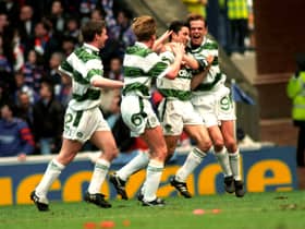 Celtic's John Collins (second right) celebrates his April 1994 derby goal in front of the Rangers fans with Simon Donnelly (right). The celebrations were accompanied by complete silence from the Rangers-only crowd after David Murray banned Celtic fans from the ground