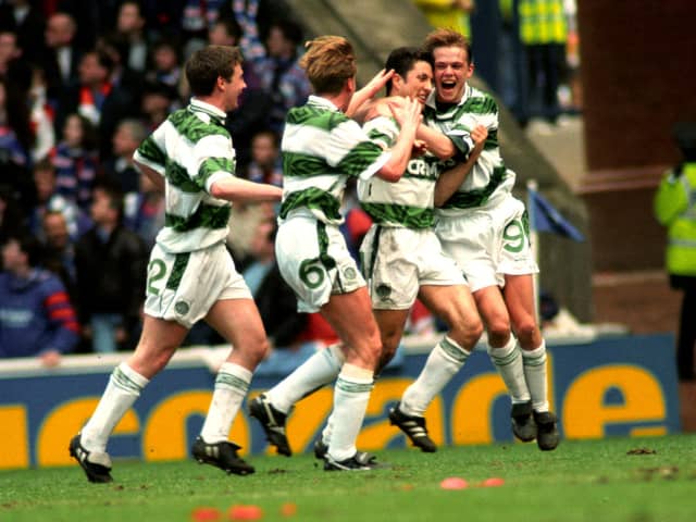 Celtic's John Collins (second right) celebrates his April 1994 derby goal in front of the Rangers fans with Simon Donnelly (right). The celebrations were accompanied by complete silence from the Rangers-only crowd after David Murray banned Celtic fans from the ground