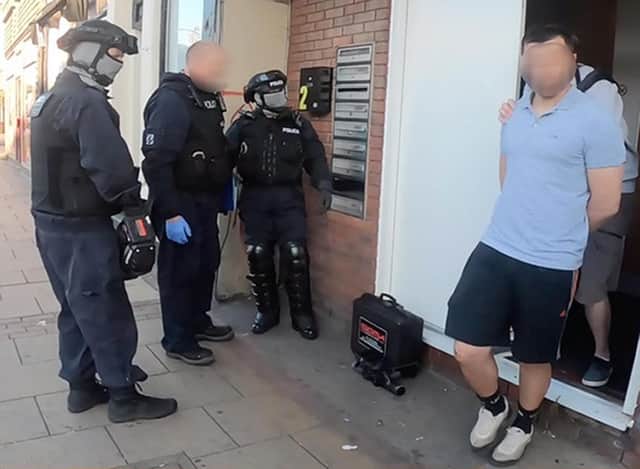A suspect being detained in Catford, London, as part of Operation Punjum