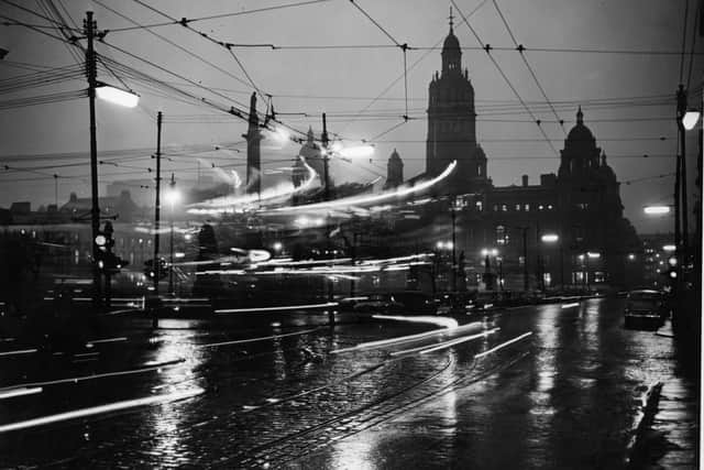 Traffic in Glasgow, 1955. Carl MacDougall's book about growing up in the city "paints a keen picture of working-class life in post-war Scotland". PIC: Hulton Archive/Getty Images