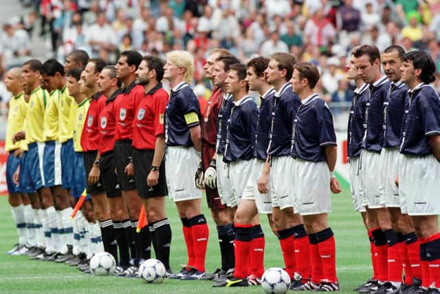 Scotland and Brazil line up before they play in the opening game of the France '98 World Cup.