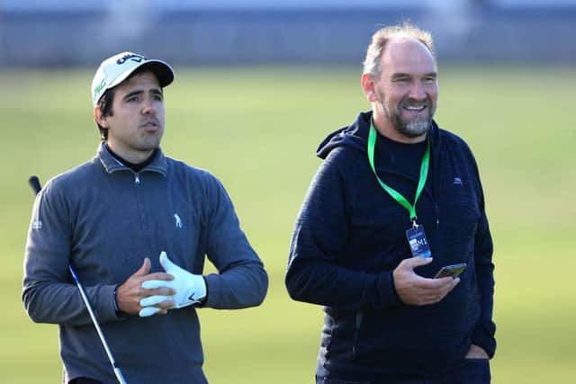 Javier Ballesteros and Scotsman golf correspondent Martin Dempster chat on the Old Course. Picture: David Cannon/Getty Images.