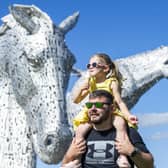 Jessica Ferguson enjoys an ice-cream with her father Mark Ferguson at the Kelpies in Falkirk. Picture: Lisa Ferguson