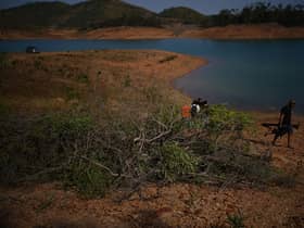 Personnel at Barragem do Arade reservoir, in the Algave, Portugal, where searches took place this week as part of the investigation into the disappearance of Madeleine McCann. Picture: Yui Mok/PA Wire