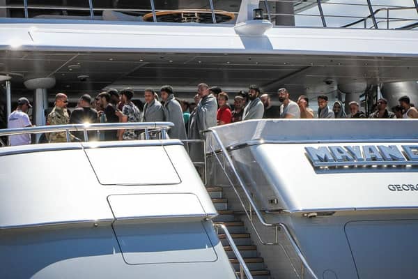 Survivors arrive to the port of Kalamata after a boat carrying hundreds of migrants sank in international waters in the Ionian Sea earlier this week.