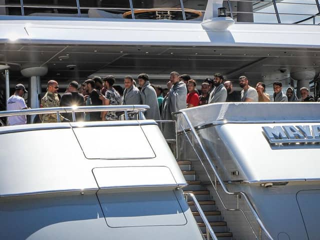 Survivors arrive to the port of Kalamata after a boat carrying hundreds of migrants sank in international waters in the Ionian Sea earlier this week.