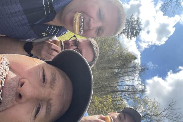 Fraser Jervis, left, tucks into a donut with some of his team-mates for the Dispatch Trophy.