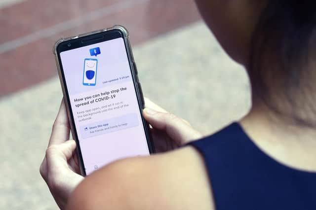 Smartphones are a useful way to share information and make transactions but not everyone has one or knows how to use it (Picture: Catherine Lai/AFP via Getty Images)